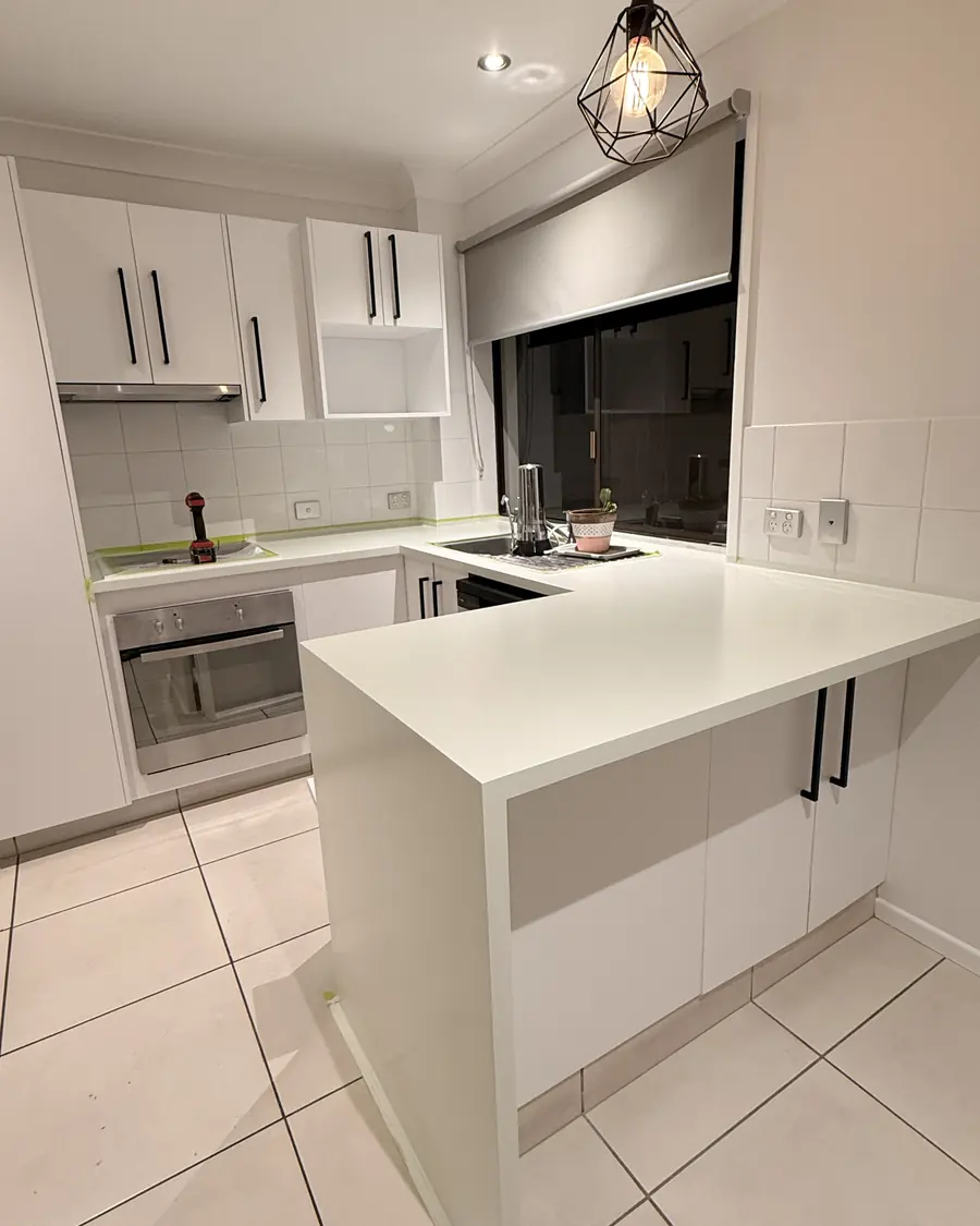 Repainted white kitchen cabinets on the Gold Coast