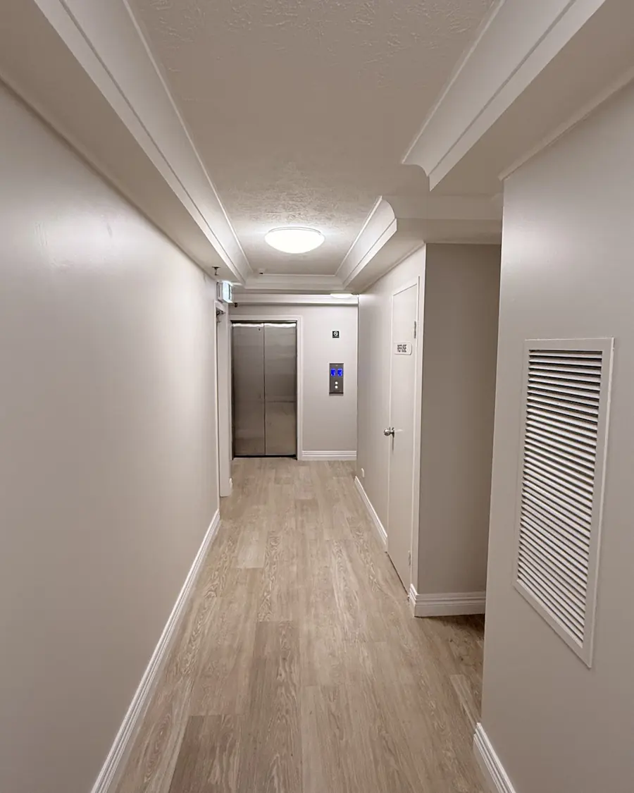 Freshly painted corridor leading to the lifts